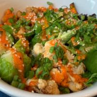 Buddha Bowl · Quinoa, brussels sprouts, roasted chickpeas, sweet potato, cauliflower, avocado, and red pep...