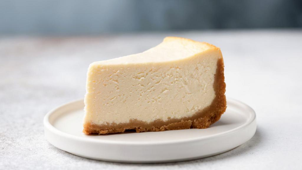 Ny Cheese Cake · A rich and creamy New York-style cheesecake baked inside a honey-graham crust.