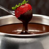 Pure Chocolate Fondue · Pick from the flavors of milk, dark or white chocolate. GF with GF Dippers. (272 cal per ser...