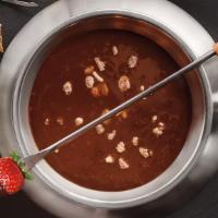 Flaming Turtle · The creamy flavor of milk chocolate is melted with caramel and topped with candied pecans. G...