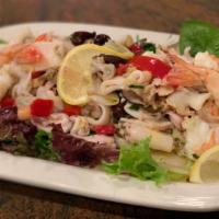 Seafood Salad · Calamari, Shrimp and Scungili with celery, olives, garlic and lemon vinaigrette.