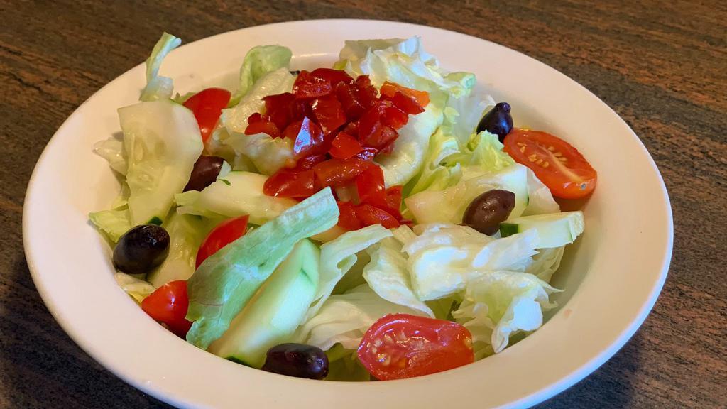 House Salad Regular · Iceberg lettuce, cucumbers, grape tomatoes, kalamata olives and roasted red peppers. Served with oil and vinegar dressing.