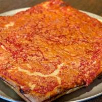 Upside Down Sicilian Pizza · Mozzarella cheese covered in tomato sauce and topped with pecorino romano cheese.