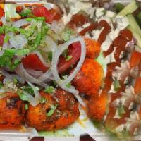 Chicken Tikka · ome with rice and chicken tikka  salad 
Lettuce tomato cucumber green olives black olives 
C...