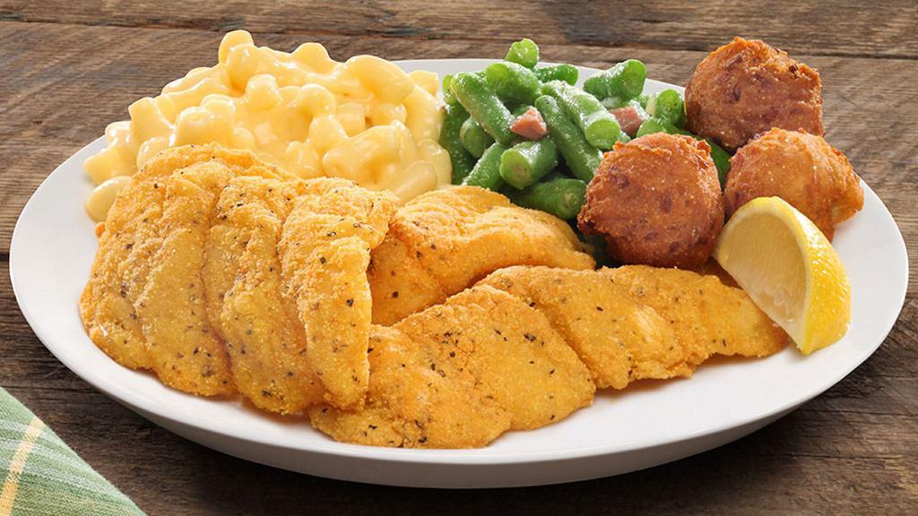 Fried Fish Family Meal  · Hand-breaded fried fish, served with lemon and tartar sauce.  Comes with 2 family sides, half a dozen rolls and a dozen chocolate chips cookies.  This meal comes with 12 pieces of fried fish (serves approx. 4-5 persons).
