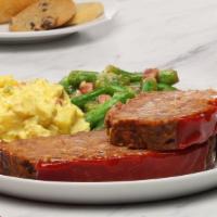 Meatloaf · Grandma's favorite recipe- made with seasoned beef.   Served with two sides.