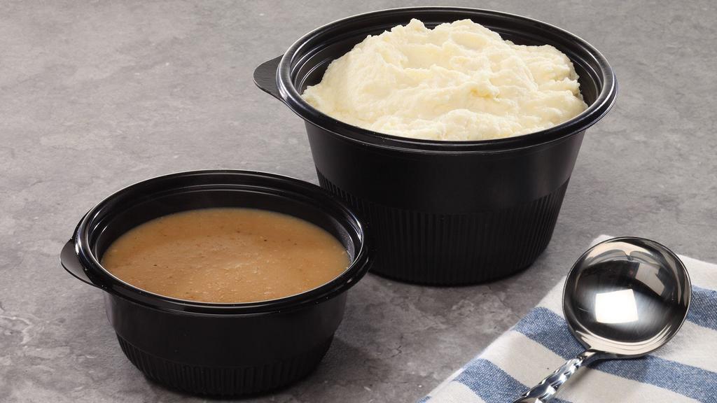 Mashed Potatoes & Gravy · Fluffy mashed potatoes, served with or without brown gravy.  Large side is served with the gravy on the side.