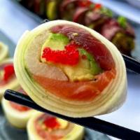 Rainbow Roll · California roll topped with tuna, salmon, whitefish and avocado. Raw.