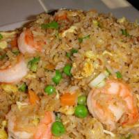 Shrimp Fried Rice · With onion, scallion, egg beans, carrots, and cabbage. Served with a soda.