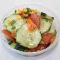 Cucumber Salad · cucumber , tomato's , cilantro, corn , Italian dressing