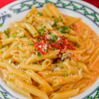 Penne Ala Vodka · pink cream sauce with vodka, prosciutto and scallions, with grilled chicken or shrimp for an...
