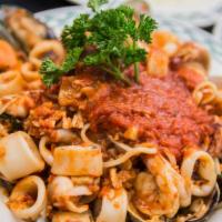 Zuppa Di Pesce · shrimp, calamari, clams, and mussels in red sauce, served hot or sweet over linguini.