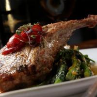 Berkshire Pork Chop · French cut, pan-roasted with cherry peppers, mustard glaze, broccoli rabe.
