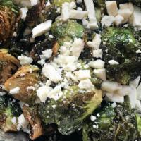 Crispy Brussel Sprouts · Spiced honey drizze, crumbled feta.