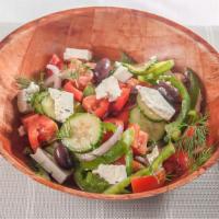 Village Salad · Tomatoes, onions, green peppers, cucumbers, feta, and olive oil.
