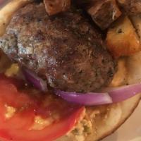 Bifteki Burger · Two beef patties, kafteri, onion, tomatoes, fries wrapped in pita.