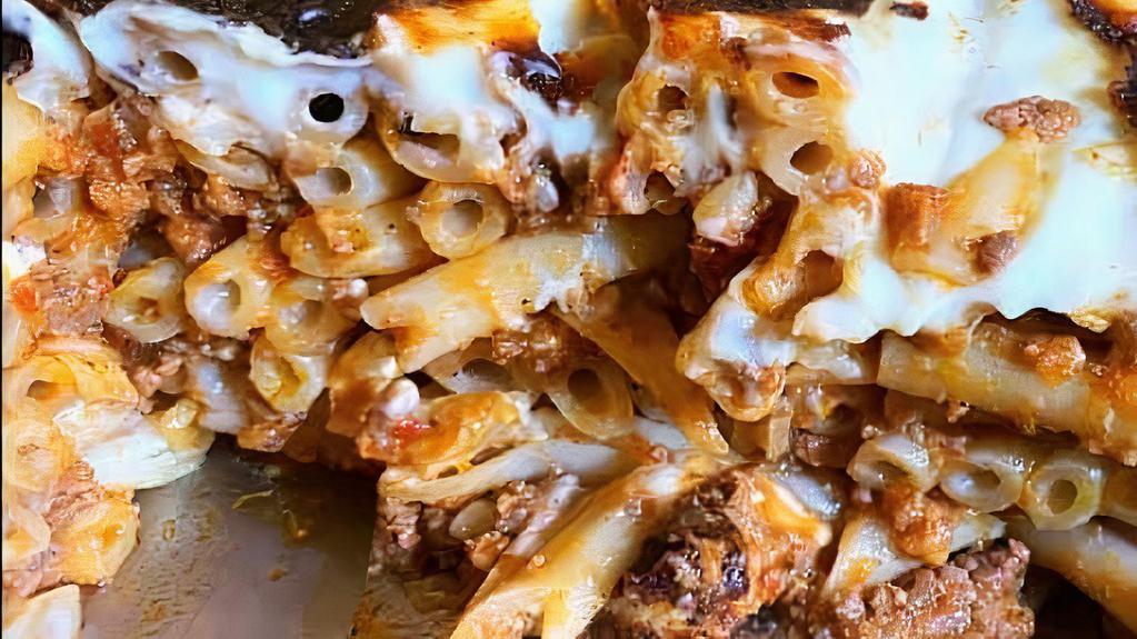 Pastitsio · Layers of tubed pasta and meat sauce and bechamel.