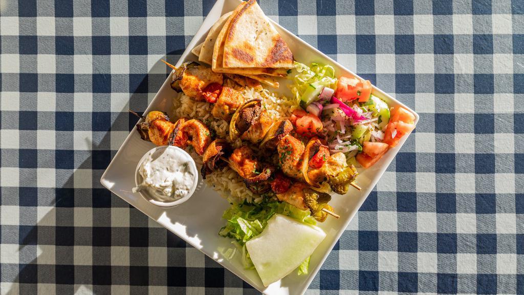 Traditional Kebobs Platter · Chicken, beef or, served over rice.