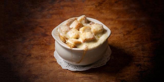 French Onion · traditional french onion soup loaded with garlic croutons and topped with melted provolone and grated parmesan