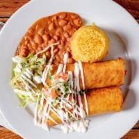 Chimichangas · Two fried flour tortillas rolled with either shredded chicken or beef; served with rice, bea...