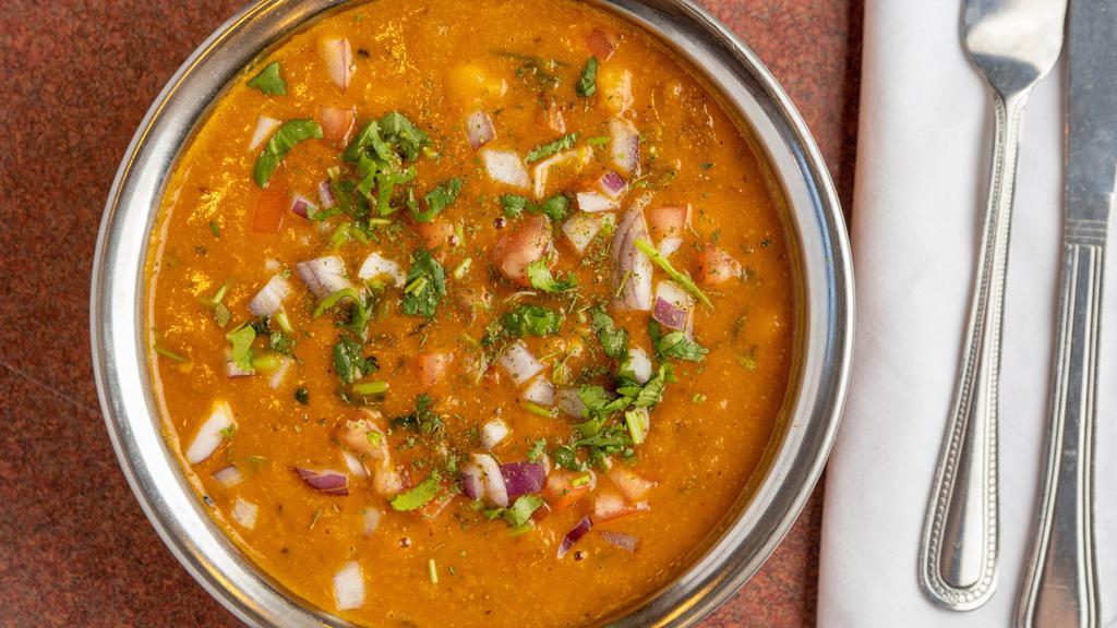 Channa Masala · Chickpeas, onions, and tomatoes cooked in tangy dry sauce.