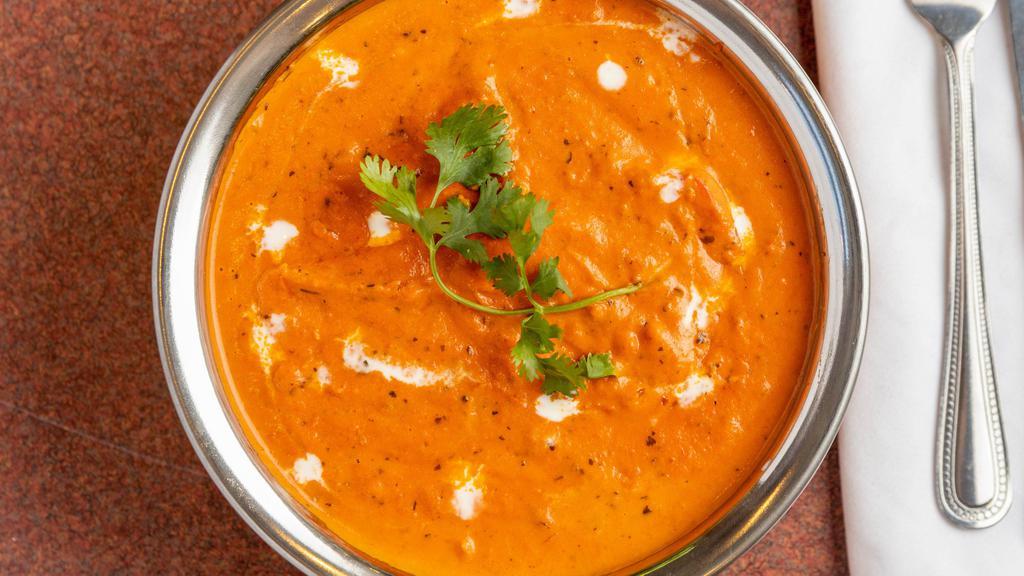 Chicken Tikka Masala · Boneless pieces of chicken marinated in yogurt and spices, cooked in the tandoor, and with tomato sauce.