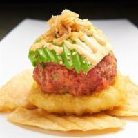 Tuna Tartar · Fresh maguro tuna, flavored with a a combination of spicy and savory seasonings, laid out on...