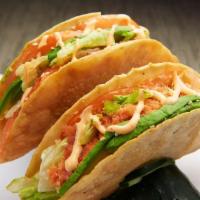Sushi Tacos · 2 tacos with fresh salmon and fresh tuna topped with a perfect combination of our homemade s...