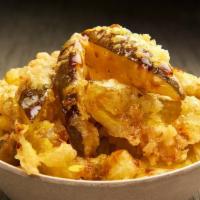 Fried Pickles · Tempura battered and fried pickles garnished with fresh leak and served with a speciality ho...