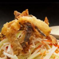 Sakekawa Salad · Crispy pieces of salmon skin served over a bed of kani mixed with cucumber and a light mayo ...