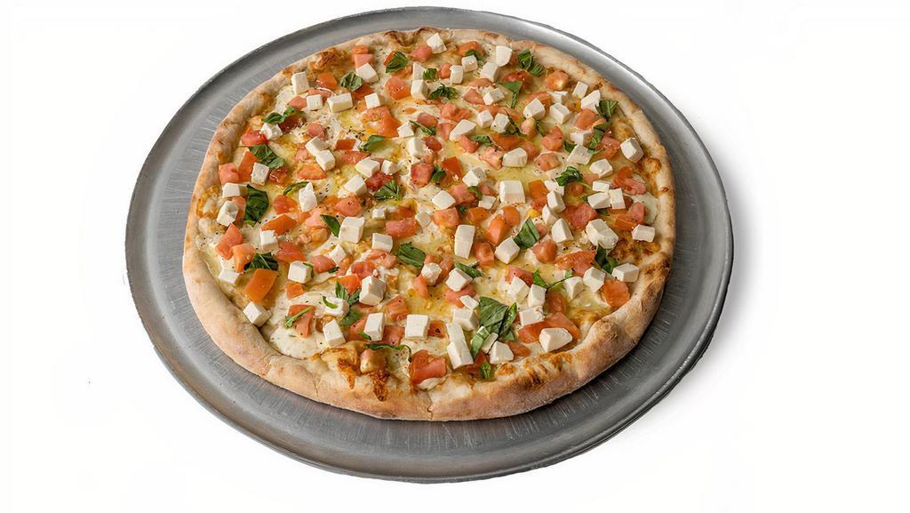 Bruschetta Pizza · Fresh mozzarella, fresh tomatoes, fresh basil, topped with olive oil and Italian spices.
