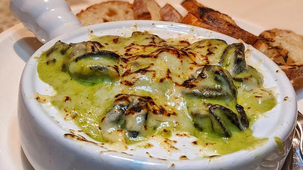 Escargot · Mornay sauce with a touch of herbs and parmesan cheese.