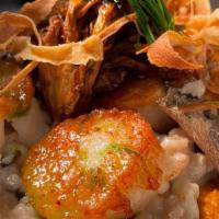 Scallop · Sautéed scallops, wild mushrooms, kimchi puree with mushroom risotto.