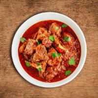 United Lamb Vindaloo · Tender lamb chunks cooked slowly with coconut, vinegar and lots of hot red chilli peppers.