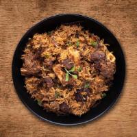 Yum Goat Biryani · Long grain premium basmati rice cooked with tender morsels of bone in goat meat in our signa...
