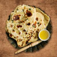 Garlic Naan Bread · Bread baked in a clay oven topped with garlic.