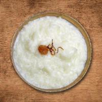 Divine Pudding · Indian dessert made of broken rice cooked with milk, cardamom pods.