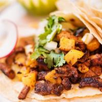 Al Pastor Taco (3 Pcs) · Marinated pork with grilled pineapple and onions, tacos topped with fresh onions and cilantr...