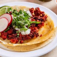 Chorizo Taco (3 Pcs) · Traditional Mexican sausage, tacos topped with fresh onions and cilantro, garnish with a lim...