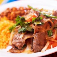Bistec A La Mexicana · Grilled chopped tender steak accompanied with onions, tomatoes, serrano peppers, and fresh c...
