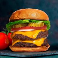 Cheesy Mania Double Burger · Two American beef patties topped with melted cheese, buttered lettuce, tomato, onion, and pi...