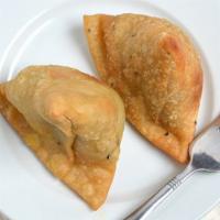 #3. Vegetable Samosa · Deep-fried patties stuffed with spices, potatoes, and green peas. Served with tamarind sauce.
