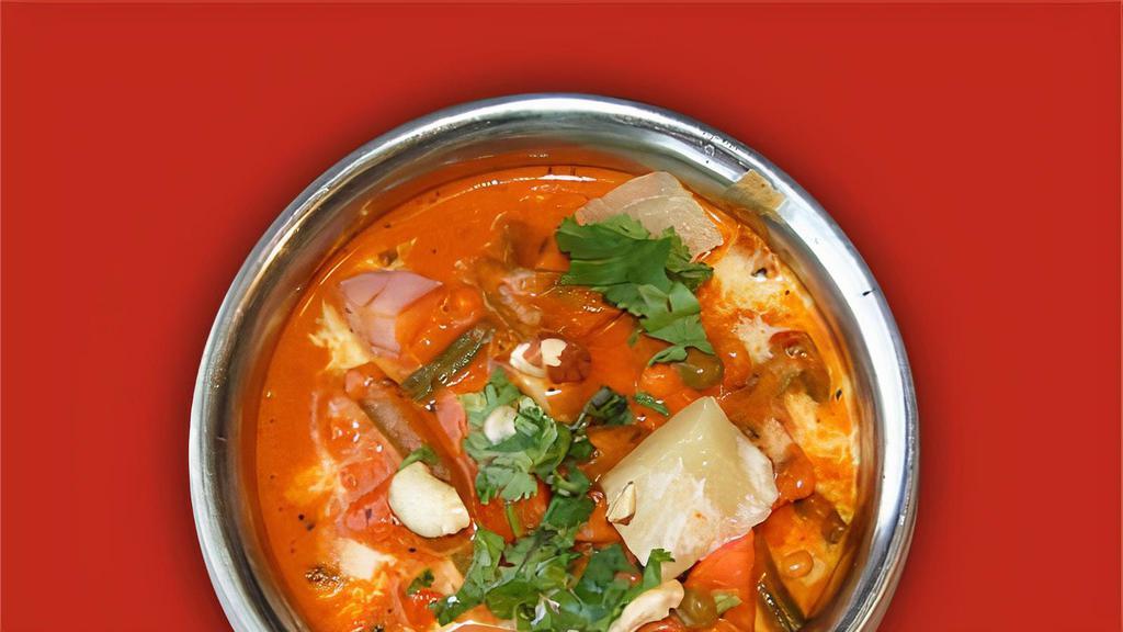 #23. Nawaratan Korma (Vegetarian Coconut Curry) · Mixed vegetables coked with coconut and Himalayan sauce and spices.