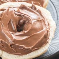 Toasted Bagel With Nutella · Toasted bagel of your choice with decadent Nutella.