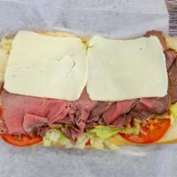 Roast Beef Melt Hero · Roast beef and melted mozzarella cheese with lettuce and tomato on a garlic bread.