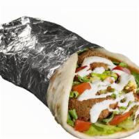 Falafel Sandwich · Served with pita, lettuce, tomatoes and choice of toppings. Served with one white sauce and ...