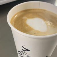 Flat White · Creamy microfoam poured over a double shot of espresso.
