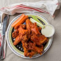Buffalo Wings · 10deep fried chicken wings sautéed in our own spicy sauce. Served carrots, celery sticks, an...