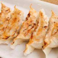 Pan Fried Pork Dumplings / 煎饺-猪肉白菜 · 8 pcs.