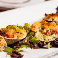 Clams Casino Style · Rendered bacon, herb butter, peppers and a parmesan bread crumb crust.